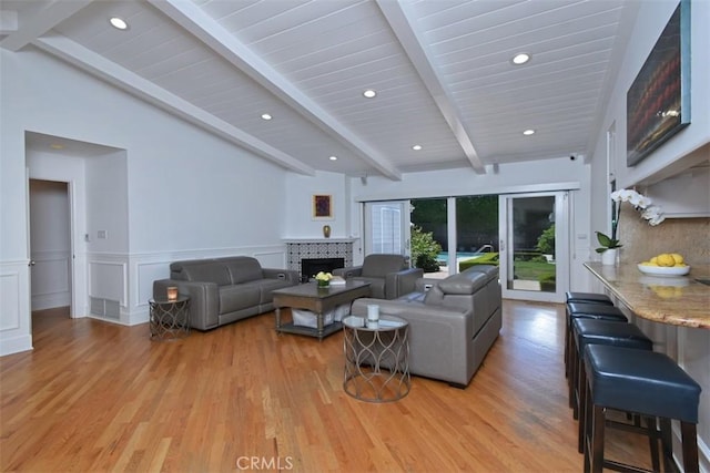 4161 Dixie Canyon Ave, Sherman Oaks, CA 91423 - living room with a tile fireplace, light wood-style flooring, recessed lighting, and wainscoting