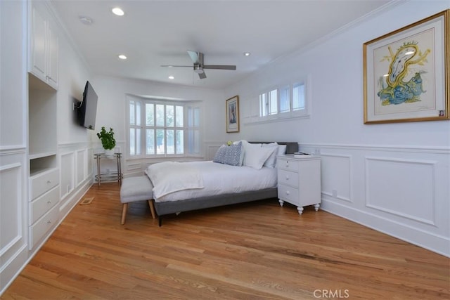 4161 Dixie Canyon Ave, Sherman Oaks, CA 91423 - bedroom featuring a decorative wall, crown molding, recessed lighting, light wood-style flooring, and wainscoting