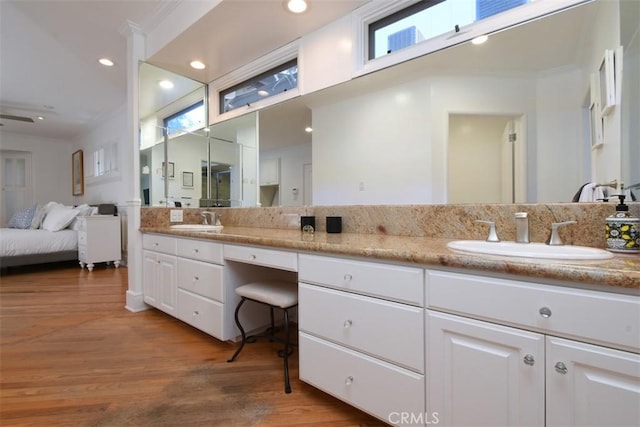 4161 Dixie Canyon Ave, Sherman Oaks, CA 91423 - bathroom with double vanity, wood finished floors, ensuite bath, ornamental molding, and recessed lighting