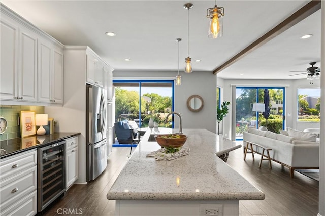 5 Catalina Point Rd, Chico, CA 95928 - kitchen with wine cooler, stainless steel fridge with ice dispenser, open floor plan, a center island with sink, and plenty of natural light