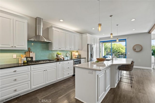 5 Catalina Point Rd, Chico, CA 95928 - kitchen with wall chimney range hood, appliances with stainless steel finishes, dark wood finished floors, white cabinetry, and recessed lighting