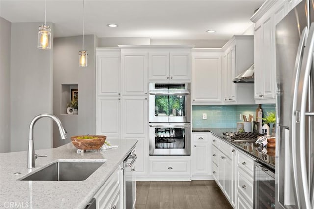 5 Catalina Point Rd, Chico, CA 95928 - kitchen with appliances with stainless steel finishes, beverage cooler, light stone countertops, white cabinetry, and recessed lighting