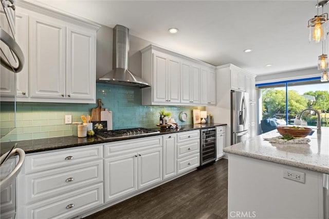 5 Catalina Point Rd, Chico, CA 95928 - kitchen featuring wall chimney range hood, stainless steel appliances, beverage cooler, dark wood-style floors, and white cabinetry