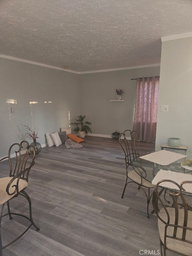 8686 San Juan Ave, South Gate, CA 90280 - dining space with crown molding, wood finished floors, and a textured ceiling