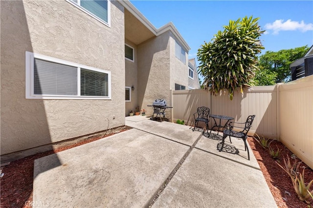 54 Kazan St Unit 27, Irvine, CA 92604 - fenced backyard with a patio and grilling area