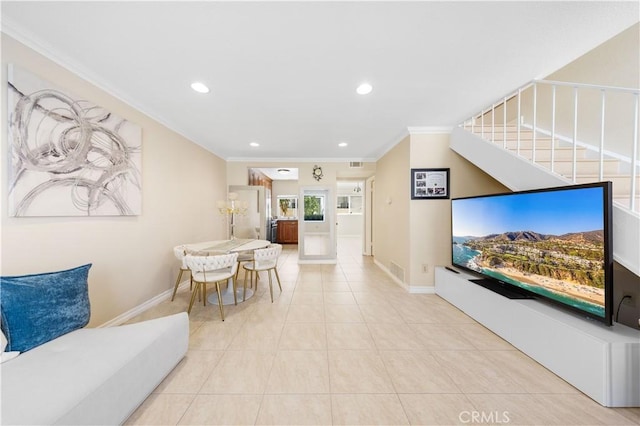 54 Kazan St Unit 27, Irvine, CA 92604 - living area with recessed lighting, crown molding, light tile patterned floors, and stairway