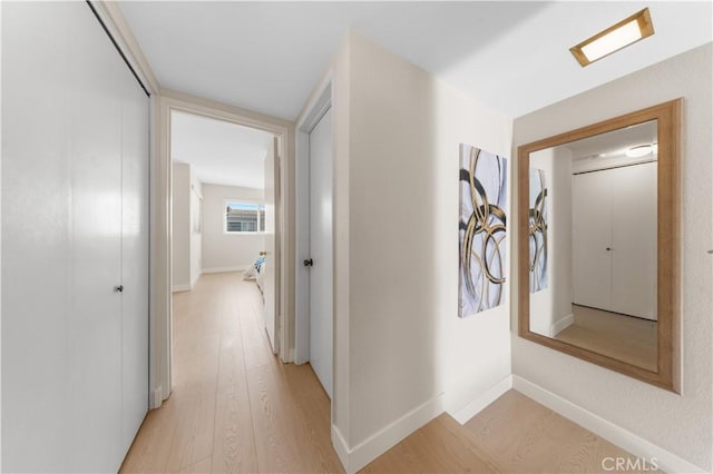 54 Kazan St Unit 27, Irvine, CA 92604 - corridor with light wood-style flooring and baseboards