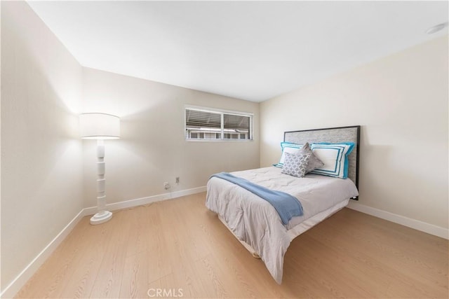 54 Kazan St Unit 27, Irvine, CA 92604 - bedroom with light wood-style flooring and baseboards