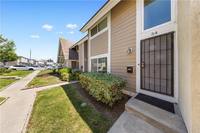 54 Kazan St Unit 27, Irvine, CA 92604 - entrance to property featuring a lawn