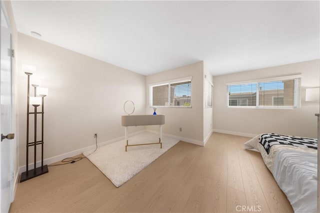 54 Kazan St Unit 27, Irvine, CA 92604 - bedroom with wood finished floors and baseboards
