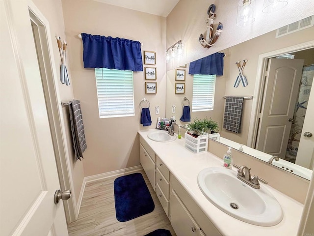 1410 Franceschi Dr, Chula Vista, CA 91913 - bathroom with double vanity and wood finished floors