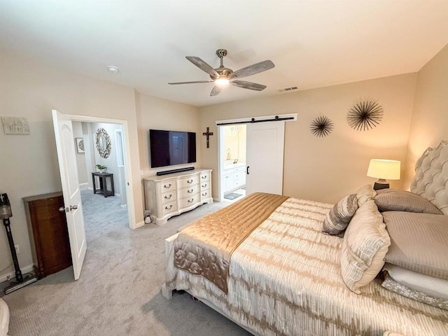1410 Franceschi Dr, Chula Vista, CA 91913 - bedroom featuring light colored carpet, a barn door, a ceiling fan, and ensuite bathroom