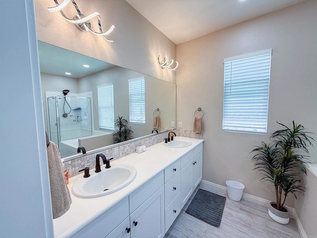 1410 Franceschi Dr, Chula Vista, CA 91913 - full bath featuring double vanity, wood finished floors, plenty of natural light, and a shower
