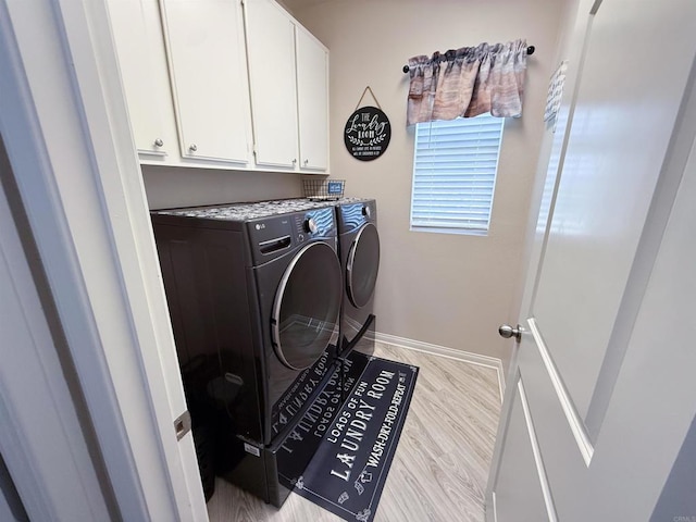 1410 Franceschi Dr, Chula Vista, CA 91913 - laundry area featuring washer and dryer, cabinet space, and light wood-style flooring