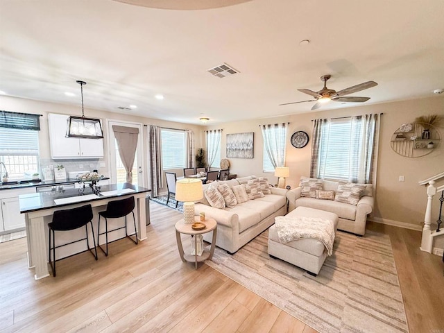 1410 Franceschi Dr, Chula Vista, CA 91913 - living room with light wood finished floors, recessed lighting, and ceiling fan