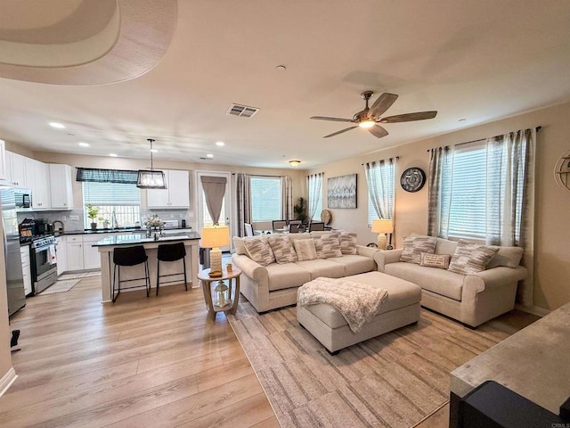 1410 Franceschi Dr, Chula Vista, CA 91913 - living area featuring light wood finished floors, recessed lighting, and ceiling fan