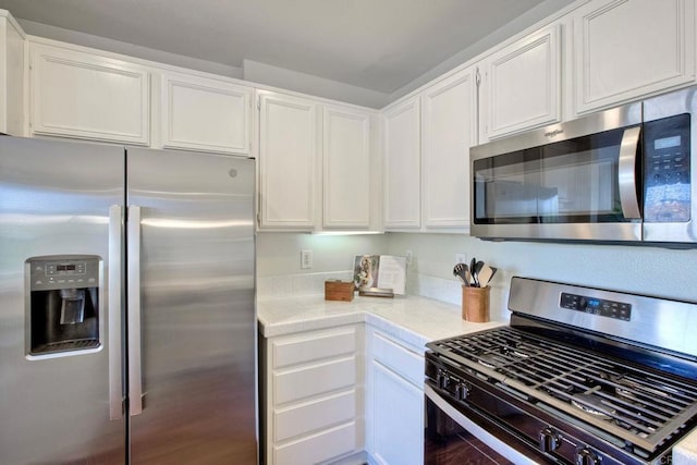 33657 Emerson Way Unit C, Temecula, CA 92592 - kitchen featuring appliances with stainless steel finishes, light countertops, and white cabinetry