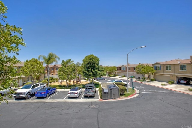 33657 Emerson Way Unit C, Temecula, CA 92592 - view of asphalt street with a residential view, street lights, and curbs