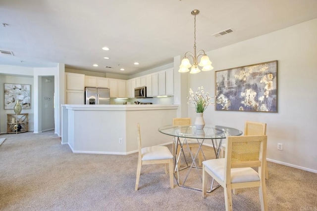 33657 Emerson Way Unit C, Temecula, CA 92592 - dining area with light colored carpet, a chandelier, and recessed lighting