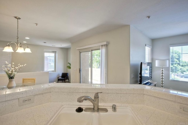 33657 Emerson Way Unit C, Temecula, CA 92592 - kitchen with plenty of natural light, a chandelier, recessed lighting, and hanging light fixtures