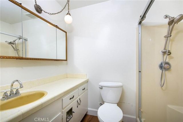 46404 Kings Canyon Rd, Lancaster, CA 93536 - full bath with an enclosed shower, vanity, and wood finished floors