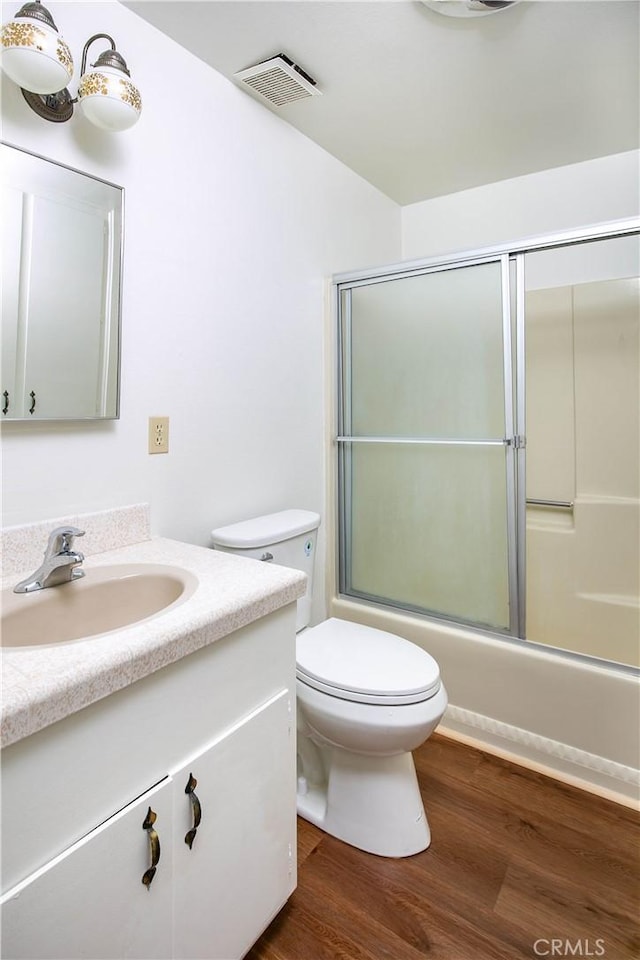46404 Kings Canyon Rd, Lancaster, CA 93536 - bathroom featuring vanity, shower / bath combination with glass door, and wood finished floors