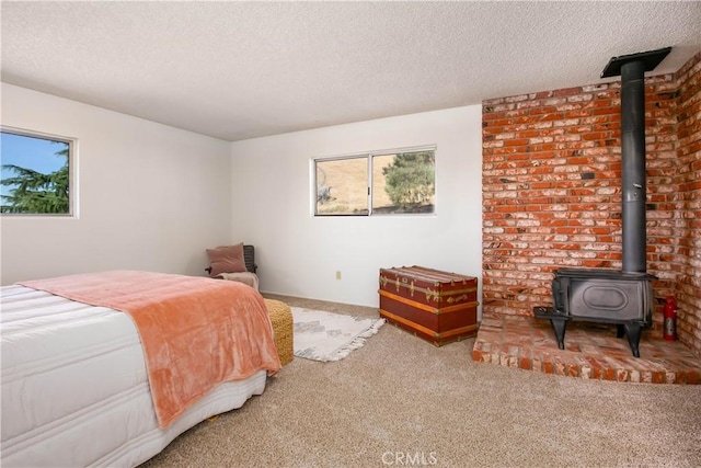 46404 Kings Canyon Rd, Lancaster, CA 93536 - carpeted bedroom with a textured ceiling and a wood stove