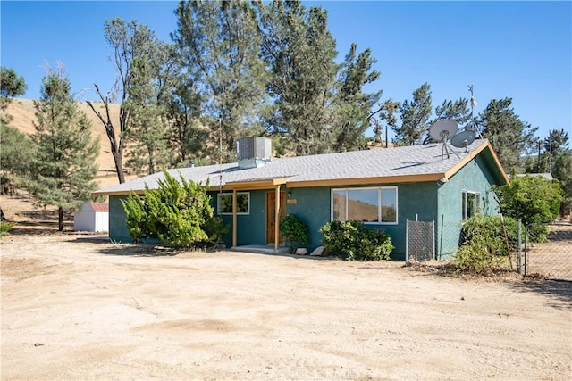 46404 Kings Canyon Rd, Lancaster, CA 93536 - view of front of house with stucco siding, roof with shingles, and a chimney