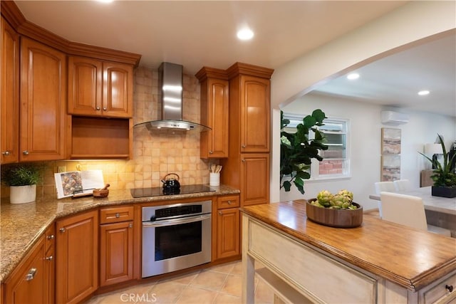 2054 Pattiz Ave, Long Beach, CA 90815 - kitchen with oven, wall chimney exhaust hood, black electric cooktop, decorative backsplash, and recessed lighting