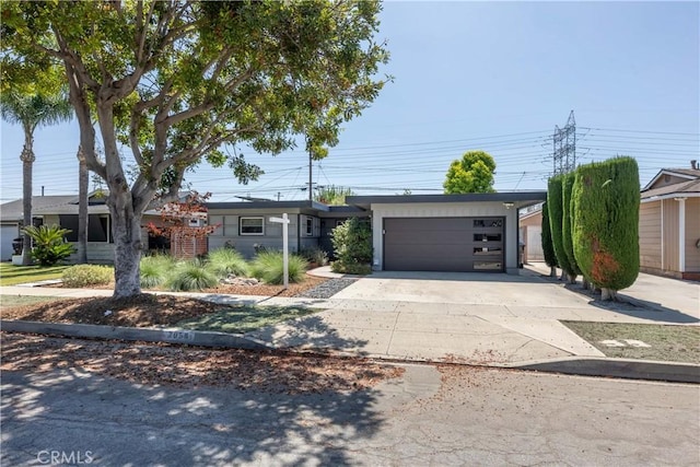 2054 Pattiz Ave, Long Beach, CA 90815 - view of front facade with concrete driveway and a garage