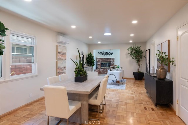 2054 Pattiz Ave, Long Beach, CA 90815 - dining space with a wall unit AC, recessed lighting, and a fireplace