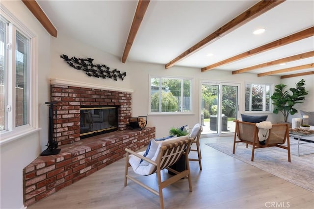2054 Pattiz Ave, Long Beach, CA 90815 - living room with plenty of natural light, wood finished floors, beamed ceiling, a fireplace, and recessed lighting