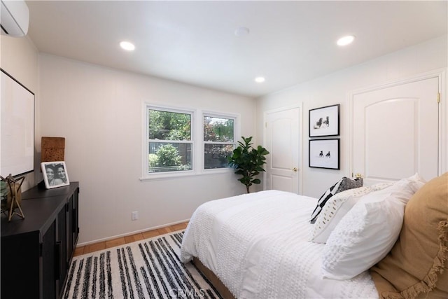 2054 Pattiz Ave, Long Beach, CA 90815 - bedroom featuring a wall unit AC, light wood-type flooring, and recessed lighting