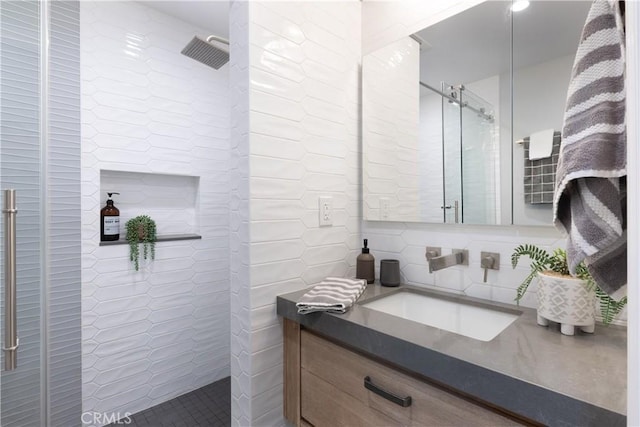 2054 Pattiz Ave, Long Beach, CA 90815 - bathroom with tile walls, tiled shower, vanity, and backsplash