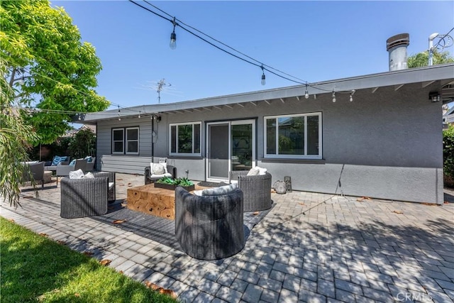 2054 Pattiz Ave, Long Beach, CA 90815 - back of house featuring outdoor lounge area, a patio, and stucco siding