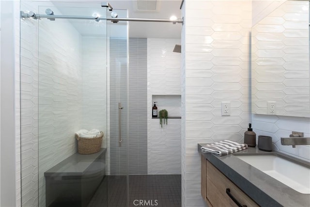 2054 Pattiz Ave, Long Beach, CA 90815 - bathroom featuring tile walls, a shower stall, and vanity