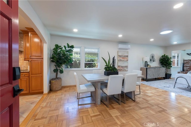 2054 Pattiz Ave, Long Beach, CA 90815 - dining area with a wall mounted AC, recessed lighting, and arched walkways