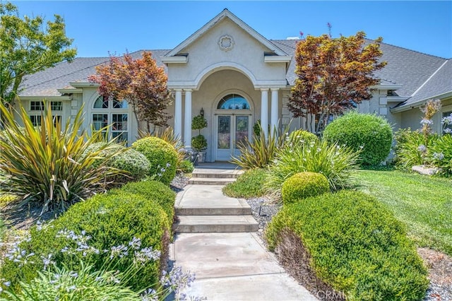2457 Remington Ct, Merced, CA 95340 - entrance to property featuring stucco siding and a shingled roof