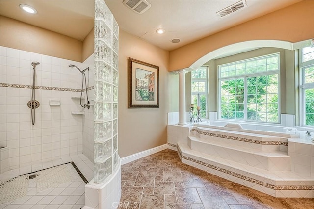 2457 Remington Ct, Merced, CA 95340 - bathroom with decorative columns, a bath, tiled shower, and recessed lighting