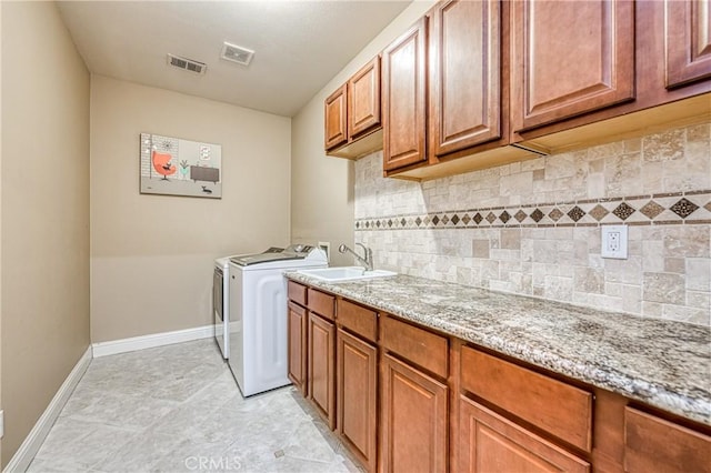2457 Remington Ct, Merced, CA 95340 - laundry area featuring cabinet space and separate washer and dryer