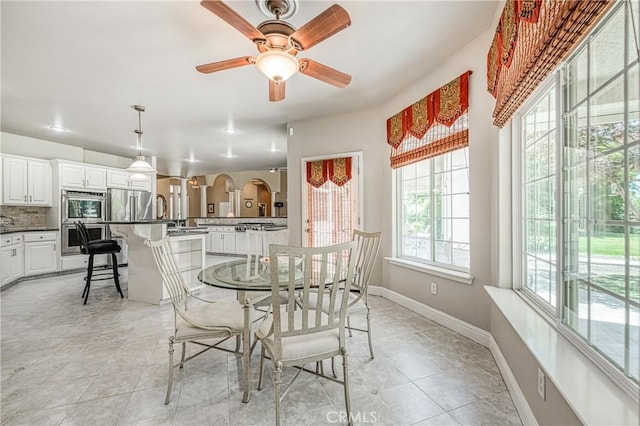 2457 Remington Ct, Merced, CA 95340 - dining space featuring a ceiling fan and light tile patterned floors