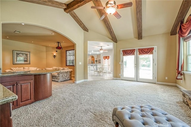 2457 Remington Ct, Merced, CA 95340 - living area featuring a ceiling fan, arched walkways, light colored carpet, and french doors