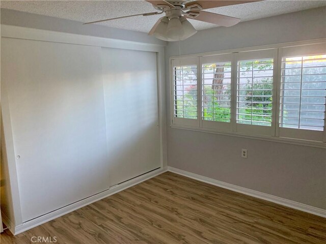 930 Avenida Majorca Unit A, Laguna Woods, CA 92637 - unfurnished room featuring wood finished floors, a ceiling fan, and a textured ceiling