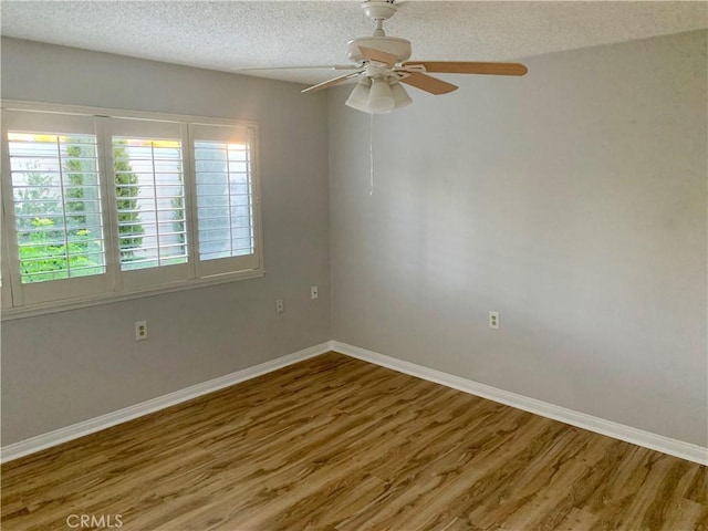 930 Avenida Majorca Unit A, Laguna Woods, CA 92637 - empty room with wood finished floors, a textured ceiling, and ceiling fan