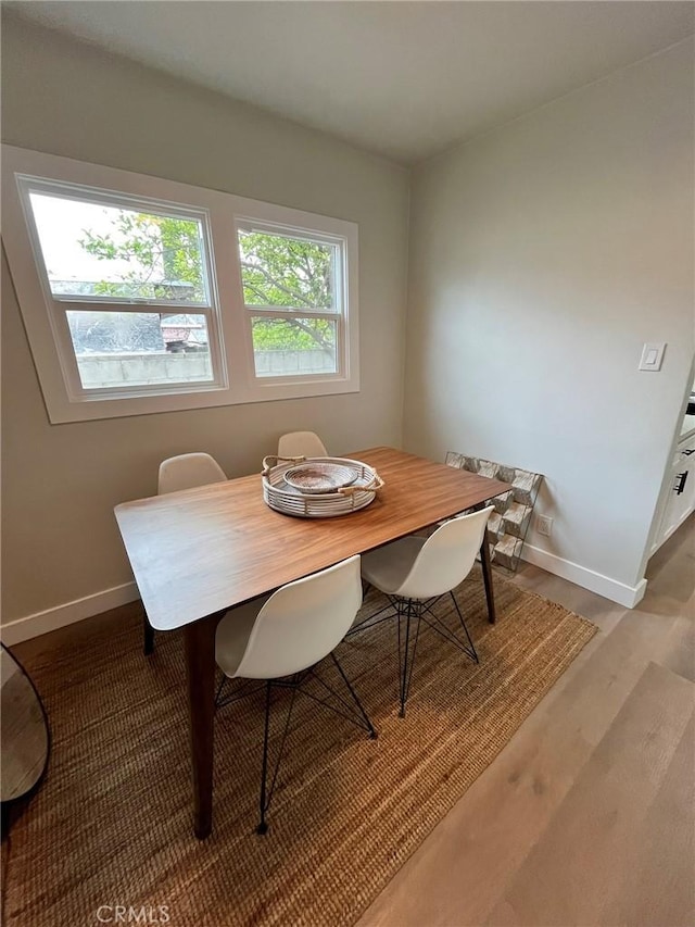 13723 Pinney St, Pacoima, CA 91331 - dining space featuring baseboards and wood finished floors