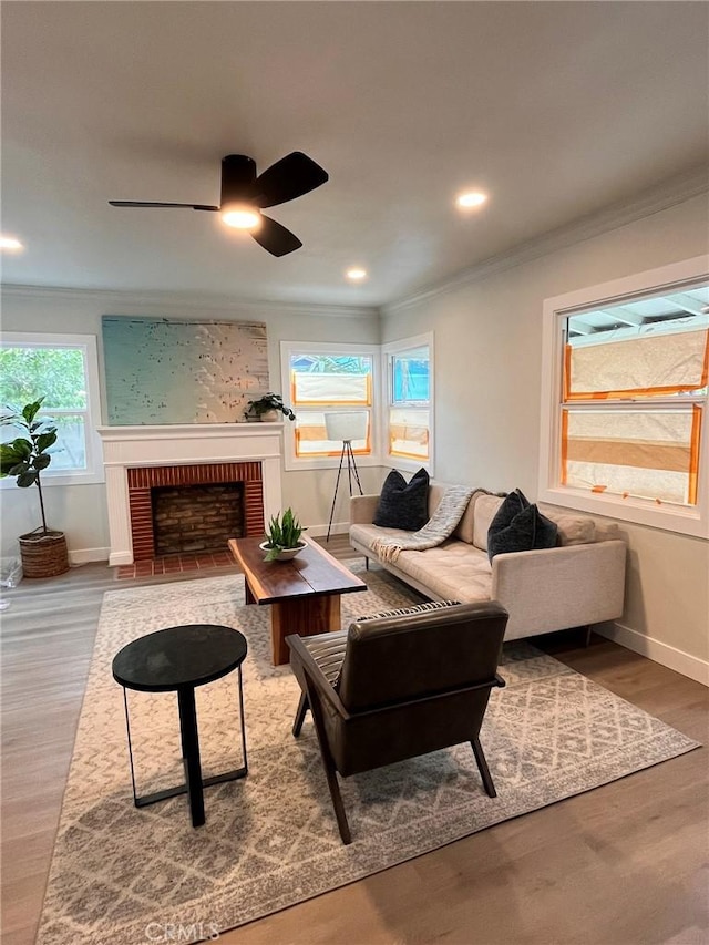 13723 Pinney St, Pacoima, CA 91331 - living room with ornamental molding, a ceiling fan, a brick fireplace, wood finished floors, and recessed lighting