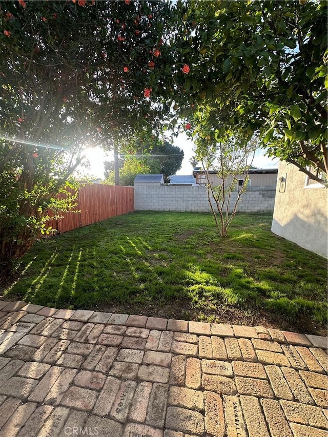 13723 Pinney St, Pacoima, CA 91331 - fenced backyard with a patio