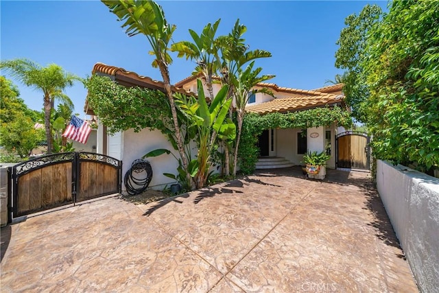 2981 Pembroke Cir, Corona, CA 92879 - view of front of property featuring a gate, stucco siding, and a tile roof