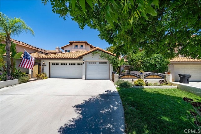 2981 Pembroke Cir, Corona, CA 92879 - mediterranean / spanish house featuring stucco siding, a tiled roof, driveway, an attached garage, and a front lawn