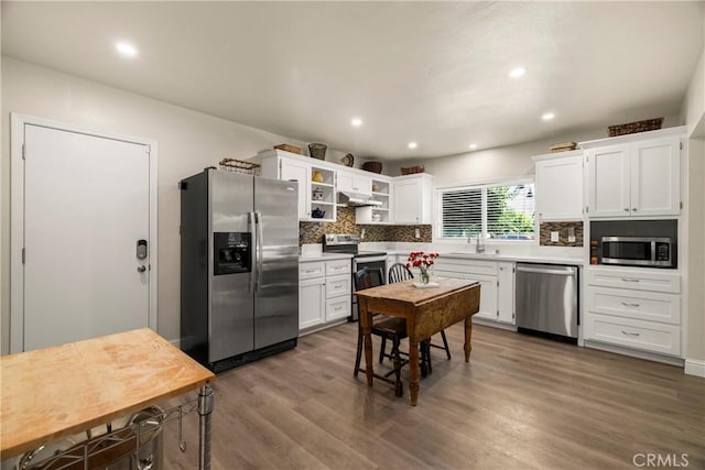 401 W 6th Ave, Chico, CA 95926 - kitchen with stainless steel appliances, tasteful backsplash, white cabinetry, wood finished floors, and light countertops